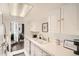 Bright kitchen featuring white cabinets, ample counter space, and modern fixtures at 9995 E Harvard Ave # 224, Denver, CO 80231
