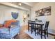 Open concept living and dining area with stylish furniture and decor at 9995 E Harvard Ave # 224, Denver, CO 80231