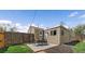 Cozy backyard featuring patio dining area with outdoor table and chairs on a stylish rug at 1705 W Stoll Pl, Denver, CO 80221