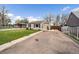 Charming single-story home with well-manicured lawn, mature trees and private driveway at 1705 W Stoll Pl, Denver, CO 80221