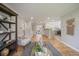 View of the living room featuring hardwood floors, neutral paint, and a view into the kitchen at 1705 W Stoll Pl, Denver, CO 80221