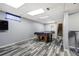 Open basement featuring a pool table and staircase leading to upper floor at 1231 W Radcliff Ave, Englewood, CO 80110