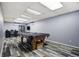 Spacious basement with a pool table and recreation area perfect for entertainment at 1231 W Radcliff Ave, Englewood, CO 80110