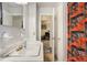 Bathroom with a single sink, vanity, and access to other rooms at 1231 W Radcliff Ave, Englewood, CO 80110