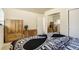 Bedroom with mirrored closet and wood furniture at 1231 W Radcliff Ave, Englewood, CO 80110