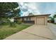 Charming single-story home with an attached garage and mature tree in a well-maintained front yard at 1231 W Radcliff Ave, Englewood, CO 80110
