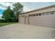 A detached multi-car garage with ample parking space on a paved driveway at 1231 W Radcliff Ave, Englewood, CO 80110