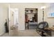 Hallway with closet; ample storage for shoes and clothing with carpet and hardwood flooring at 1231 W Radcliff Ave, Englewood, CO 80110