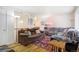 Cozy living room featuring hardwood floors, comfortable seating, and natural lighting at 1231 W Radcliff Ave, Englewood, CO 80110