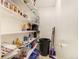 Well-stocked pantry with ample shelving, providing plenty of storage space at 1231 W Radcliff Ave, Englewood, CO 80110