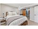 Basement bedroom with ensuite closet and barn door at 551 E Caley Dr, Centennial, CO 80121