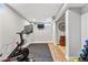 Finished basement gym with Peloton bike and exercise mat at 551 E Caley Dr, Centennial, CO 80121