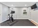 Finished basement gym with Peloton bike and yoga mats at 551 E Caley Dr, Centennial, CO 80121