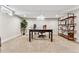 Finished basement office with large desk and built-in shelving at 551 E Caley Dr, Centennial, CO 80121