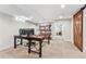 Finished basement office with large desk and barn door at 551 E Caley Dr, Centennial, CO 80121