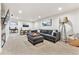 Finished basement Gathering room with sectional sofa and large TV at 551 E Caley Dr, Centennial, CO 80121