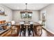 Farmhouse style dining room with wooden table and black metal chairs at 551 E Caley Dr, Centennial, CO 80121