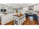 Modern kitchen with copper sink, stainless steel appliances, and custom island at 551 E Caley Dr, Centennial, CO 80121