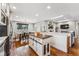 Modern kitchen with copper sink, stainless steel appliances, and custom island at 551 E Caley Dr, Centennial, CO 80121