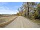 Nature trail with trees and a bench at 551 E Caley Dr, Centennial, CO 80121