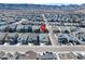 Expansive aerial view of a suburban neighborhood nestled against a backdrop of majestic mountains at 8187 Mount Kataka St, Littleton, CO 80125