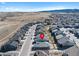 Picturesque aerial view of a neighborhood with homes backing up to open land and mountain views at 8187 Mount Kataka St, Littleton, CO 80125