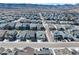 Expansive aerial view of a suburban neighborhood nestled against a backdrop of majestic mountains at 8187 Mount Kataka St, Littleton, CO 80125