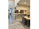 Dining area with modern table and chairs adjacent to the kitchen, creating a seamless flow at 7810 W 87Th Dr # E, Arvada, CO 80005