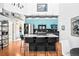 Modern kitchen featuring stainless steel appliances, a large island with seating, and stylish blue cabinetry at 7525 E 1St Pl # 1010, Denver, CO 80230