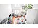 An overhead view of the living room highlights stylish furnishings, bright lighting and a spacious open-concept layout at 7525 E 1St Pl # 1010, Denver, CO 80230