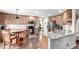 Spacious kitchen showcasing stainless steel appliances, granite countertops, and a breakfast nook at 7234 S Kellerman Way, Aurora, CO 80016