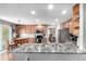 Bright kitchen with stainless steel appliances, hardwood floors, and ample counter space at 7234 S Kellerman Way, Aurora, CO 80016