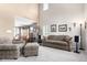 Bright living room with high ceilings, neutral color palette, comfortable seating, and an open layout at 7234 S Kellerman Way, Aurora, CO 80016