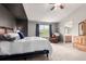 Bright main bedroom with vaulted ceilings, sitting area, and ensuite bath at 7234 S Kellerman Way, Aurora, CO 80016
