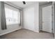Cozy bedroom with plush carpeting, ample natural light from the window, and a spacious closet at 7195 S Yantley Way, Aurora, CO 80016