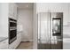 Modern kitchen with stainless steel appliances and white cabinets at 7195 S Yantley Way, Aurora, CO 80016