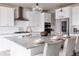 Bright kitchen features a stainless steel refrigerator, granite countertops and modern appliances at 7195 S Yantley Way, Aurora, CO 80016