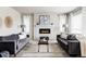 Cozy living room with a fireplace, modern decor, and comfortable seating arrangement at 7195 S Yantley Way, Aurora, CO 80016