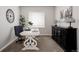 Bright home office featuring a decorative desk, stylish decor, and ample natural light at 7195 S Yantley Way, Aurora, CO 80016