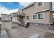 An inviting outdoor patio with stone accents and comfortable seating, perfect for relaxation and entertaining at 7195 S Yantley Way, Aurora, CO 80016