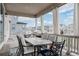 Covered patio featuring an outdoor dining area with cushioned seating, views of backyard, and great for entertaining at 7195 S Yantley Way, Aurora, CO 80016