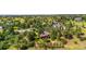 Aerial view of the home and surrounding neighborhood full of mature trees and mountain views at 8662 Kim Ct, Parker, CO 80134