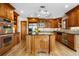 Gourmet kitchen featuring custom cabinets, a center island, stainless steel appliances, and abundant storage space at 8662 Kim Ct, Parker, CO 80134