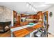 Well-equipped kitchen with stainless steel appliances, custom wood cabinets, and a spacious island at 8662 Kim Ct, Parker, CO 80134