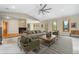 Inviting living room with a stone fireplace, comfortable seating, and large windows providing ample natural light and scenic views at 8662 Kim Ct, Parker, CO 80134