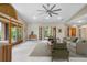 Spacious living room featuring neutral tones, comfortable seating, and expansive windows offering views of the surrounding greenery at 8662 Kim Ct, Parker, CO 80134