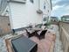 Small backyard patio with table and chairs, perfect for outdoor dining at 3074 Distant Rock Ave, Castle Rock, CO 80109