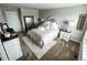 Spacious bedroom with queen bed, dresser, and neutral color scheme at 3074 Distant Rock Ave, Castle Rock, CO 80109