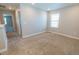 Empty bedroom with neutral walls, carpet, white trim, and a bright window for lots of natural lighting at 3074 Distant Rock Ave, Castle Rock, CO 80109