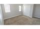 Bright bedroom features neutral carpet, two windows with blinds, and a closet with sliding doors at 3074 Distant Rock Ave, Castle Rock, CO 80109